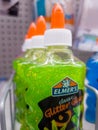 Close up of green ELMERS Glue on shelf at stationary store