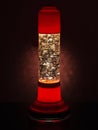 Glitter lava lamp with light behind. Genuine vintage 1970 edition, red orange colour.