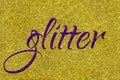 Glitter lettering word ultra violet on gold sparkle texture. Shiny background Royalty Free Stock Photo