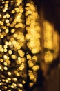 Glitter lights background. Holiday bokeh texture. Dark gold and black Royalty Free Stock Photo