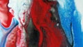 Glitter paint drip ink spill red blue fluid drop Royalty Free Stock Photo