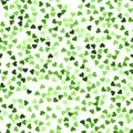 Glitter seamless texture. Actual green particles. Endless pattern made of sparkling hearts. Mesmeric