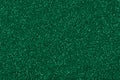 Glitter texture in stylish green tone, background for your shiny design. Royalty Free Stock Photo