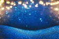 glitter vintage lights background. blue, gold and black. de focused. Royalty Free Stock Photo