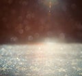 Glitter vintage lights background. gold, silver and black. defoc