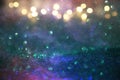 Glitter vintage lights background. green, gold and black. de-focused. Royalty Free Stock Photo