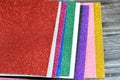 Glittered colorful Eva foam sheets, colored cardboard, rubber pad, sponge papers for school arts and crafts, pile of multicolored