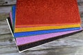 Glittered colorful Eva foam sheets, colored cardboard, rubber pad, sponge papers for school arts and crafts, pile of multicolored