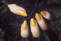 Glittered orange nails manicure