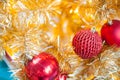 Glittering Baubles with Glowing Sparkling Gold defocused Light bokeh Illumination background with decorated Christmas Tree. Royalty Free Stock Photo