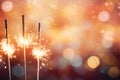 Glittering burning sparklers against blurred colorful bokeh background. Celebrating Christmas and New Year\'s Eve