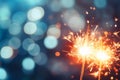 Glittering burning sparklers against blurred colorful bokeh background. Celebrating Christmas and New Year\'s Eve