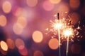 Glittering burning sparklers against blurred colorful bokeh background. Celebrating Christmas and New Year\'s Eve