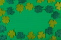 Glittering clovers on green background. St. Patrick\'s Day background Royalty Free Stock Photo