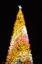 Glittering Glowing Sparkling Gold defocused Night Light bokeh Illumination background with decorated Christmas Tree. Special Royalty Free Stock Photo