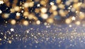 Glittering gold stars and shimmering particles cascade over a deep navy blue background evoking a Christmas and Happy Royalty Free Stock Photo