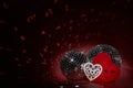 Glittering mirror disco ball and decorative hearts. Valentine`s Day. Holiday party. Entertainment, disco, music show background Royalty Free Stock Photo