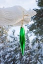 Glittering one christmas green tree toy in white mitten. Idea of merry and happy new year 2020 holiday.