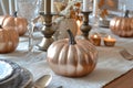 A Glittering Rose Gold Pumpkin Centerpiece on a Table Setting Royalty Free Stock Photo