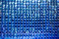 Glittering shiny blue sequin wall decoration for texture and background.