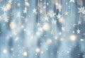 Glittering silver stars suspended against a soft blue bokeh background Royalty Free Stock Photo