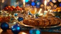 Glittering string lights illuminate the table reflecting off shiny silver menorahs and sparkling blue ornaments
