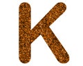 Glittery brown letter K on a white isolated background