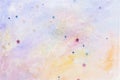 Glittery star confetti on colorful abstract pastel watercolor background