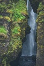 Gljufrabui waterfall Iceland hidden in cave in summer.