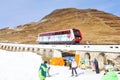 Global climate change: Snowboarder testing artificial snow at Parsenn above Davos city