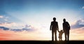 Global Day of Parents concept: Parents watching the sunset with their children Royalty Free Stock Photo