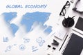 Global economy. Overhead view of office stationery, business icons and world map on white background, collage Royalty Free Stock Photo