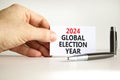 2024 global election year symbol. Concept words 2024 global election year on beautiful white paper. Beautiful white background.