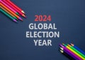 2024 global election year symbol. Concept words 2024 global election year on beautiful black paper. Beautiful black background.