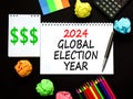 2024 global election year symbol. Concept words 2024 global election year on beautiful white note. Beautiful black table