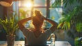 Global Employee Health and Fitness Month. Close-up photo of an employee relaxingly stretching his arms above his head Royalty Free Stock Photo