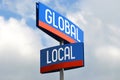 Global and local - street sign, sky in background