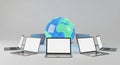 Global Network Concept with Laptops and a Digital Earth Globe technology internet Royalty Free Stock Photo