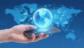 Global network concept with smartphone and digital earth hologram Royalty Free Stock Photo