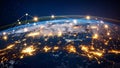 Global network connections over Earth at night with city lights and data transfer Royalty Free Stock Photo