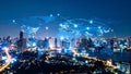 Global network connections over illuminated cityscape at night, data transfer concept Royalty Free Stock Photo