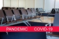 Global pandemic with coronavirus COVID-19 Empty airport departure lounge terminal waiting area with chairs Royalty Free Stock Photo