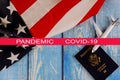 Global pandemic with coronavirus COVID-19 Travel tourism, emigration the USA American flag with U.S. passport and passenger model Royalty Free Stock Photo