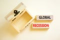 Global recession symbol. Concept words Global recession on wooden blocks. Beautiful white table white background. Wooden empthy