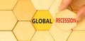 Global recession symbol. Concept words Global recession on wooden puzzles. Beautiful yellow table yellow background. Businessman