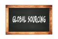 GLOBAL SOURCING text written on wooden frame school blackboard