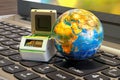 Global testing concept. PCR Thermal Cycler with Earth Globe on the laptop keyboard, 3D rendering