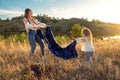 Global view, real life around the globe, local living. Mom and daughter in national clothes and flower wreaths are Royalty Free Stock Photo