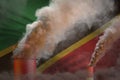 heavy smoke of industry pipes on Saint Kitts and Nevis flag - global warming concept, background with space for your text -