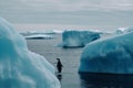 Global Warming Concept with Penguin on a Stranded Melting Iceberg emphasizing the danger of Global Warming